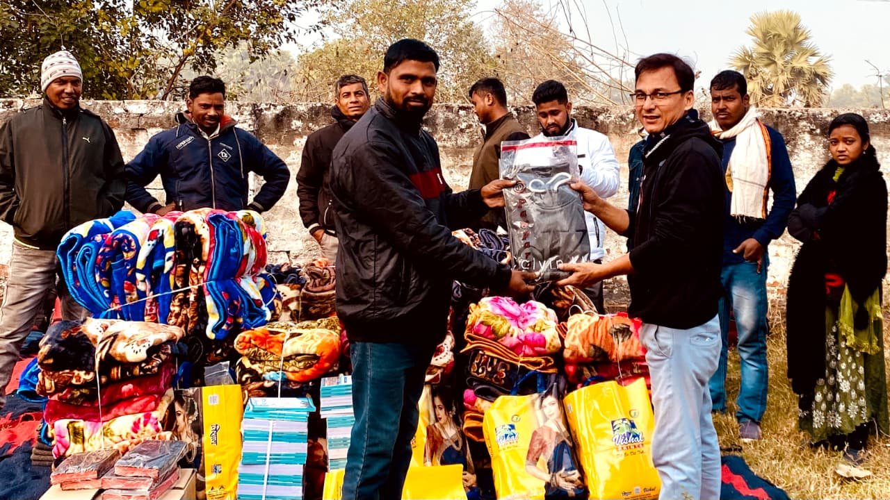 DCT trustees and field coordinators actively delivering aid in rural Bihar
